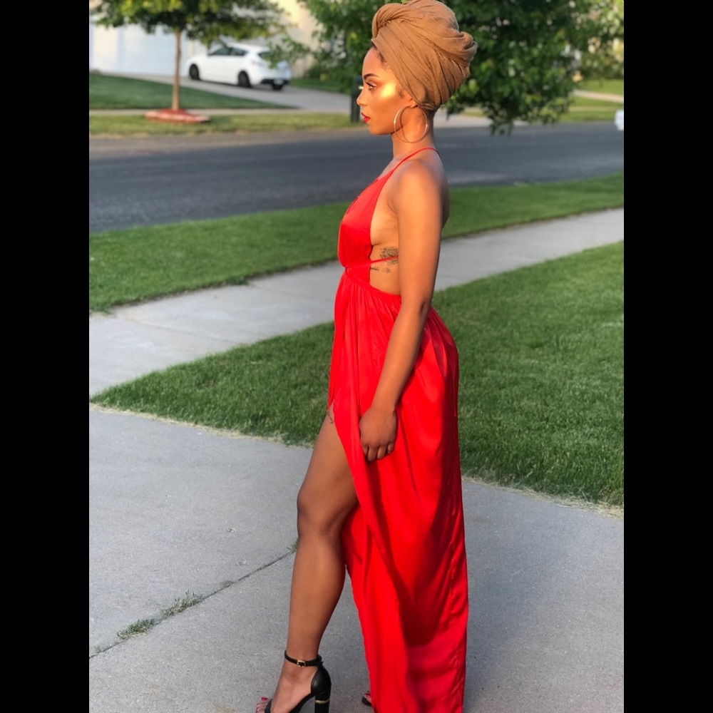 Red floor length wrap dress.